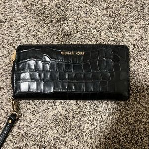 Black wallet with wrist sling